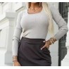 Pull matière brillante